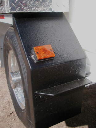 Optional black epoxy chip guard applied to square fender for Harben Model E trailer jetters